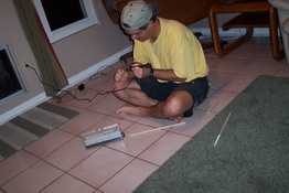 Daddy's putting the final touches on the wands for Patrick's birthday