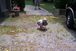 Every time Ryan tried to pick up the second ball, the first one would roll out of his arms