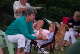 Nana helping Julia hold the baby