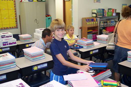 Alex organizing his school supplies