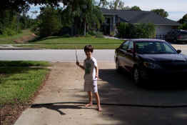 Demonstrating his wizarding technique