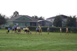 Alex catching a high snap