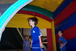 Playing in the dodge ball bouncy house