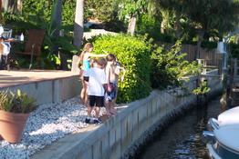 The kids were "fishing" a ball out of the gulf off the seawall