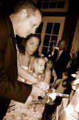 John and Laurie helped Emma cut the cake