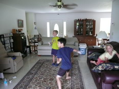 Preston and Patrick playing tennis on the Wii