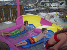 Alex and Carter about to go down a slide