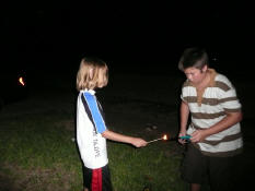 Alex and Stephen lighting fireworks on July 4.