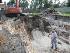 That guy's crazy - the backhoe is still moving!