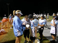 Signing the "game" ball