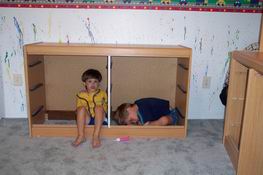 They were pretending to be asleep in the dresser.  (Go figure)  Patrick's face looks like that because he was "snoring"