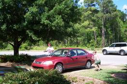 Mark and Alex battling around the car