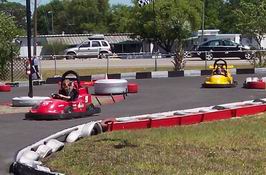 Alex (red car) with Patrick (yellow car) hot on his heels