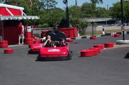 Me hiding behind my hand while Patrick imitates Mario Andretti