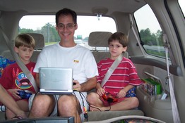 Mark hopped in back to play golf on the xBox with the boys.  Not a bad picture, considering I took it over my shoulder while driving down the highway!
