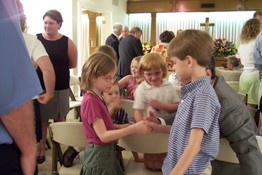 Faith and Alex thumb wrestle at the second visitation