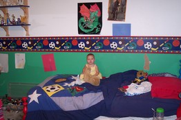 Emily enjoying Patrick's stuffed animals