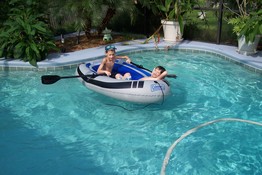 Patch was kickin' back while Alex rowed him around the pool