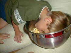 Alex eating popcorn "like a pig"