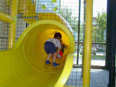 Patch pushing Alex UP the slide at Chic Fil A