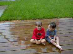 Alex and Patch playing in the rain