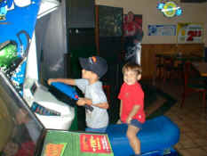 Alex and Patch riding the snowmobile race game