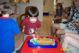 The poor kid just can't blow out candles for his life!