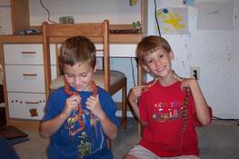Justin and Alex with snake necklaces