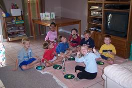 A bunch of happy campers eating cake