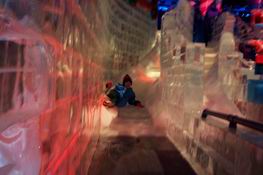 Patrick careening down one of the ice slides