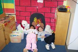 Reading by the fireplace between activities