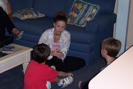 The boys played a card game with Kelly.