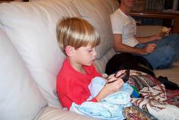 Modern day kid - a Palm Pilot and his bankie