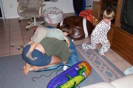 Daddy plays "tickle turtle" with the kids