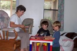 Nana's helping cut out monster trucks!