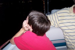 Patch watching the display on the boat