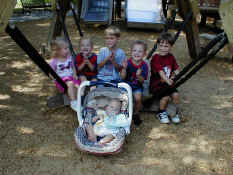 Clara, Nathan, Alex, Carter, Patrick, and Baby Andrew at the Playground