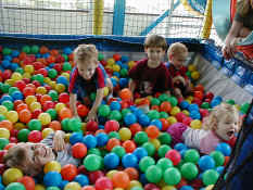 Alex, Carter, Patch, Nathan, and Clara in the ball pit