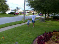 Alex and Daddy playing horseshoes