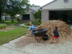 Alex and Patrick shoveling mulch