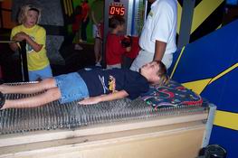 Alex on a bed of nails