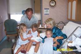 The girls meeting their baby brother