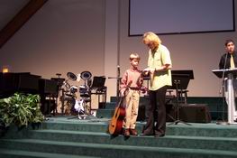 Receiving his awards for memorizing pieces