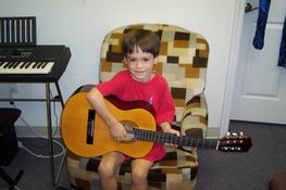 Patrick's first guitar lesson'