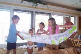 The girls made a Father's Day banner for Mike and let Alex join in their presentation