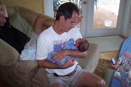 Mark's as bad as I am - you can't keep a baby from his arms!