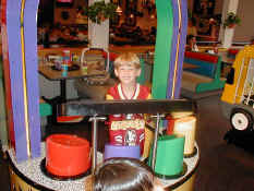 Alex playing drums at Chuck E Cheese