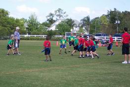 Alex is in the bright blue shorts and green shirt