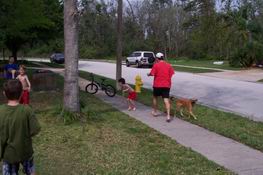 Alex on the left, Patch on the sidewalk, both in red shorts, on the offensive!