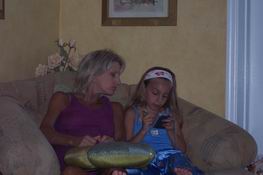 Heather showing Mary Beth a Palm Pilot game